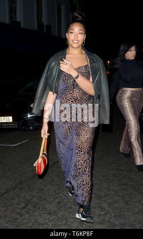 Jordyn Woods wears a see-through leopard dress to celebrate her mother
