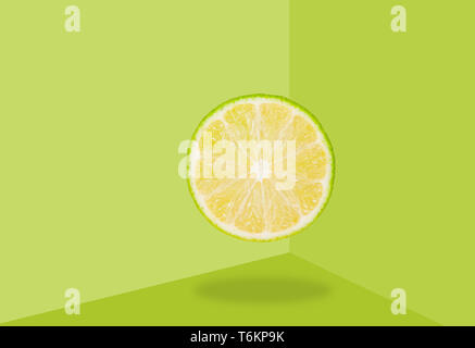 Half lime levitate in air on green background. Concept of fruit levitation. Stock Photo