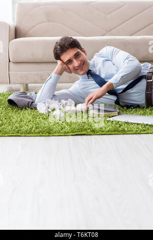 Young handsome man working under startup project at home Stock Photo