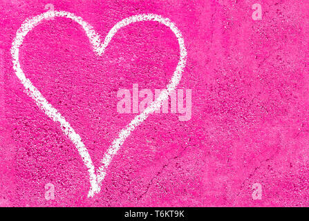 Grunge heart on pink concrete Stock Photo