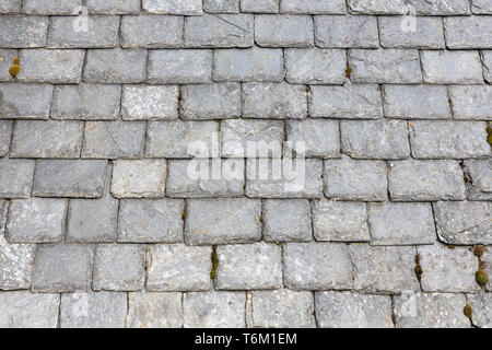 Weathered slate roof tiles background Stock Photo