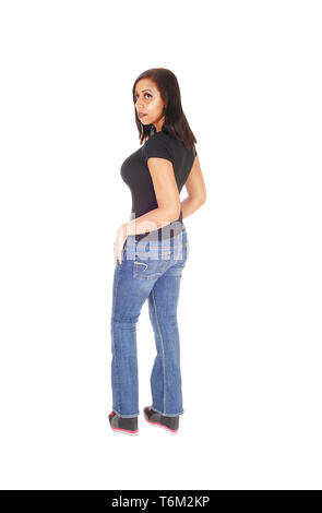 Tall woman standing in jeans from the back Stock Photo