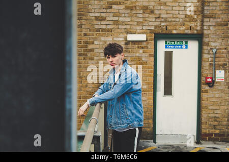 Young stylist model with denim jacket Stock Photo