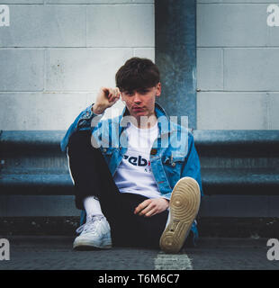 Young stylist model with denim jacket Stock Photo