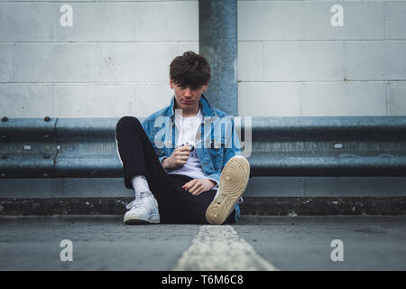 Young stylist model with denim jacket Stock Photo