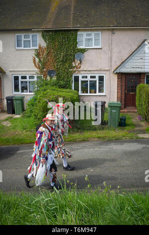 Two Morris Dancers head for home from the South Stoke May Fair in Oxfordshire. Stock Photo