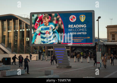 The Reading Lights giant LED illuminated display panel outside Reading Station advertising the Reading United football match against Leeds United. Stock Photo