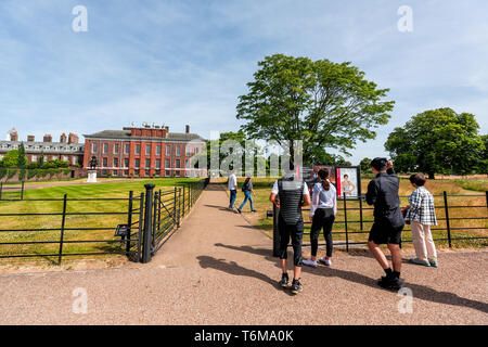 London, UK - June 24, 2018: People tourists walking entering Hyde Park and Kensington Palace entrance exterior in sunny summer Stock Photo