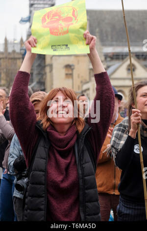 Demonstrators at rally react on hearing that Parliament has endorsed a motion to declare a formal climate emergency. Stock Photo