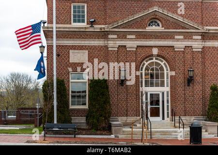 Wytheville, USA - April 19, 2018: Small town village signs flags for historic post office brick building in southern south Virginia Stock Photo
