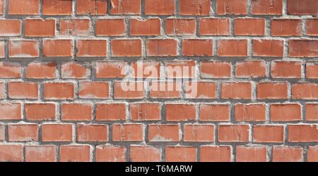 Orange brown brick background with grey grout. Stock Photo