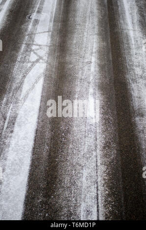 Snowy roads seen from above during day in late wintertime Stock Photo