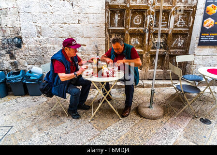 Bari, Italy - March 10, 2019: Italian workers having lunch while resting from their work. Stock Photo