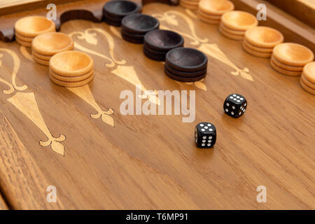 Dice on a backgammon board Stock Photo