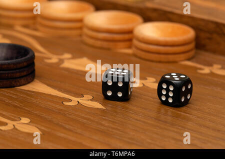 Dice on a backgammon board Stock Photo