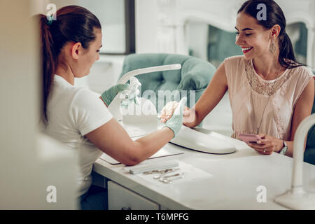 Beaming good-looking adult woman being in great mood Stock Photo