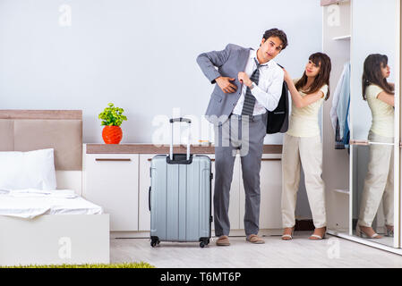 Wife seeing her husband off to business trip Stock Photo