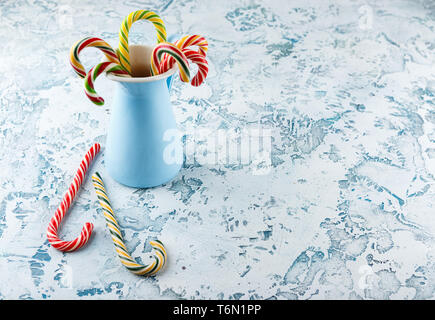 Christmas decors with light background. Candy cane. Stock Photo