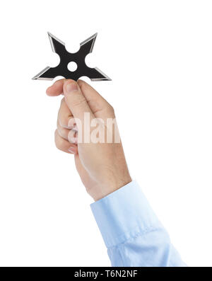 Hand is throwing ninja shuriken Stock Photo