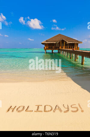 Word Holidays on beach Stock Photo