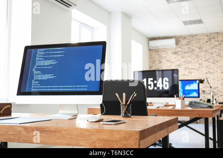 Office interior with computers and tables. Workplace design Stock Photo