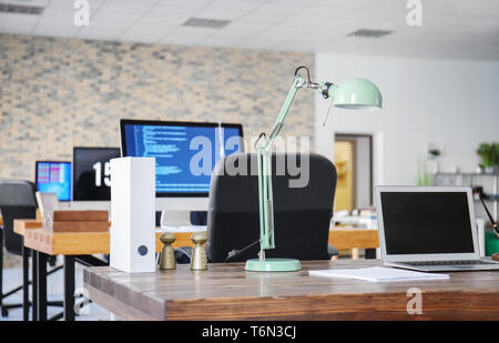 Office interior with computers and tables. Workplace design Stock Photo