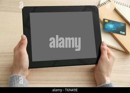 Young woman using tablet computer for online food delivery Stock Photo