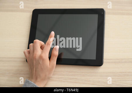 Young woman using tablet computer for online food delivery Stock Photo