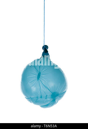 Deflated blue balloon at a rope; isolated over white Stock Photo