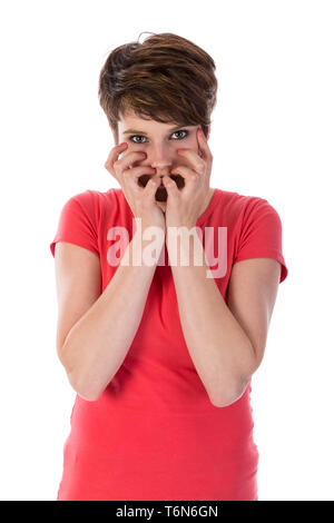 Disturbed woman with hands for face Stock Photo