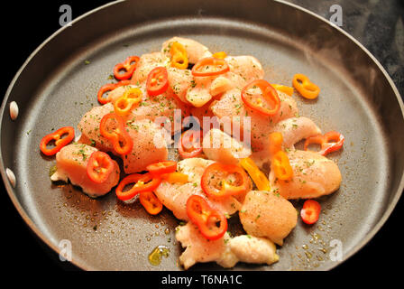 Boneless Chicken Cooking with Sweet Peppers & Parsley Stock Photo
