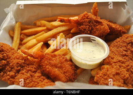 Fried Seafood Dinner in a Takeout Box Stock Photo