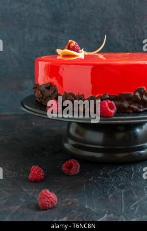 Mousse cake with red mirror glaze. Stock Photo