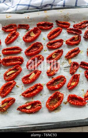 Sun-dried tomatoes with spices and olive oil. Stock Photo