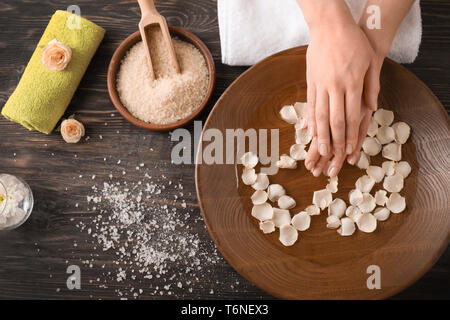 young-woman-undergoing-spa-manicure-treatment-in-beauty-salon-stock