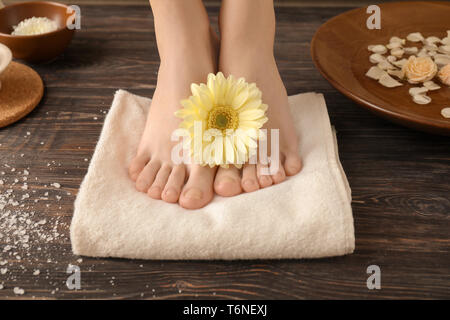 Young woman with beautiful pedicure after treatment in spa salon Stock Photo