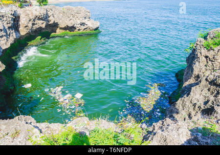 sea polluted by garbage, plastics and wastewater in the city of Santo Domingo, Dominican Republic, where the color and smell is fetid due to polluti Stock Photo