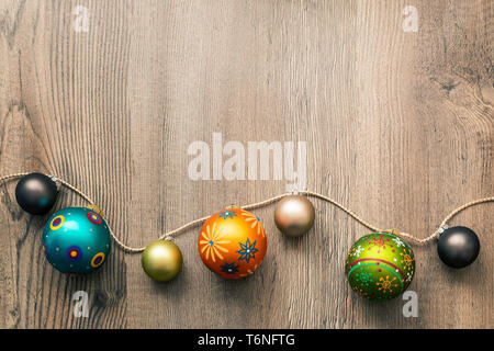 Christmas decoration glass balls on a wooden background Stock Photo