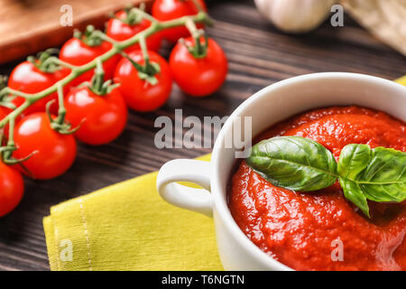 Tureen with tasty tomato sauce on table, closeup Stock Photo