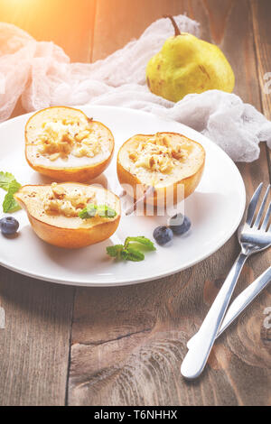 Pear with ricotta cheese, honey and cinnamon Stock Photo