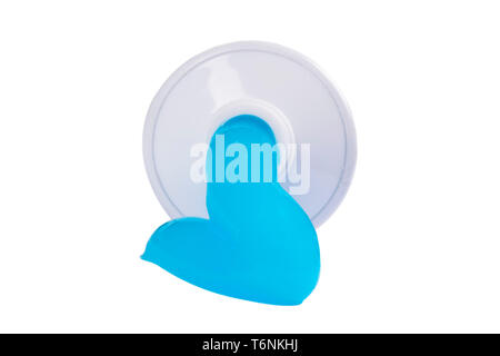 Toothpaste isolated on white background. Tube of blue toothpaste isolated on white with clipping path. Close up. Toothpaste squeezed out from a tube. Stock Photo