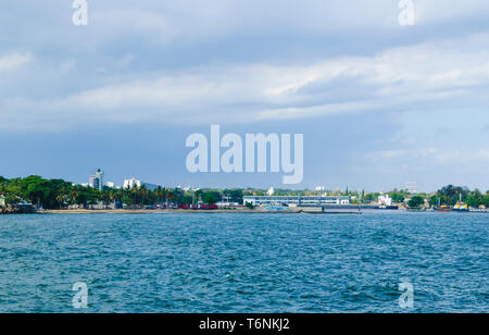 View of the port of Santo Domingo Dominican Republic from Juan Baron square, with beautiful sunny day and blue waters with boats arriving at port. Stock Photo