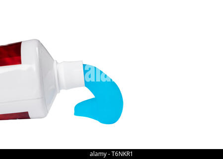 Toothpaste isolated on white background. Tube of blue toothpaste isolated on white with clipping path. Close up. Toothpaste squeezed out from a tube. Stock Photo