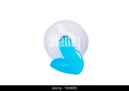 Toothpaste isolated on white background. Tube of blue toothpaste isolated on white with clipping path. Close up. Toothpaste squeezed out from a tube. Stock Photo