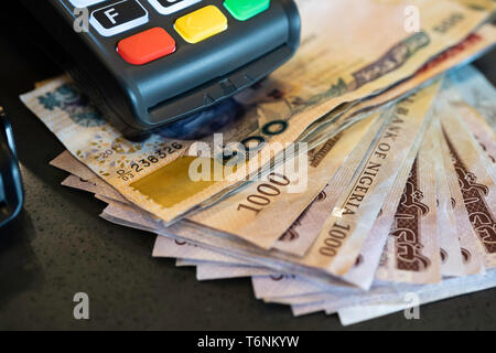 Point of Sale Machine with Nigerian Naira notes Stock Photo