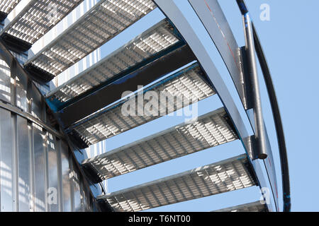 Metal staircase against a bright blue sky Stock Photo