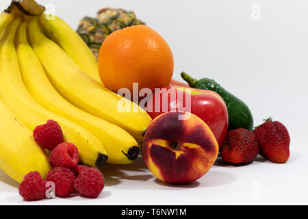 Assortment of tropical fruits portraying clean eating and vegan lifestyles. Fresh, organic, whole foods, plant based eating. Stock Photo