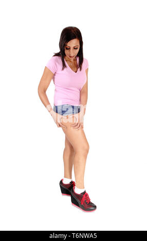 Slim woman checking her tights with her hands Stock Photo
