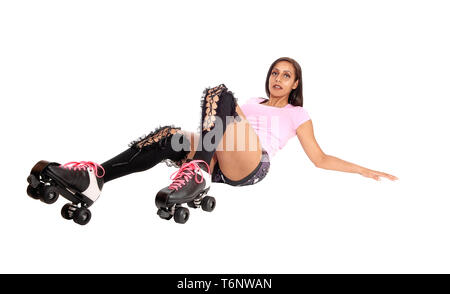 Roller skating woman lying on floor Stock Photo