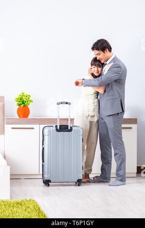 Wife seeing her husband off to business trip Stock Photo